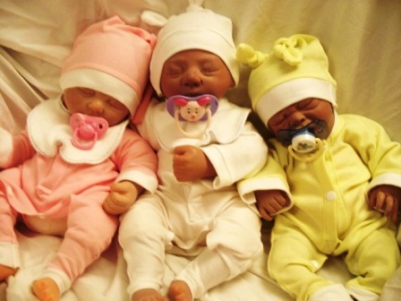 premature babies triplets sleeping soundly